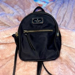 Kate Spade miniature book bag. Color (black)